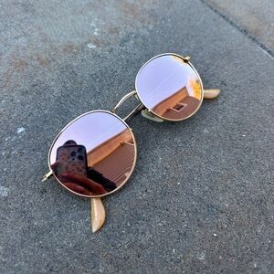 Pink lens circle frame glasses